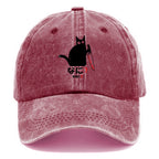 A Puzzled Cat Holding A Knife Washed Cap