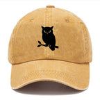 Owl perched on branch at night - Washed Cap